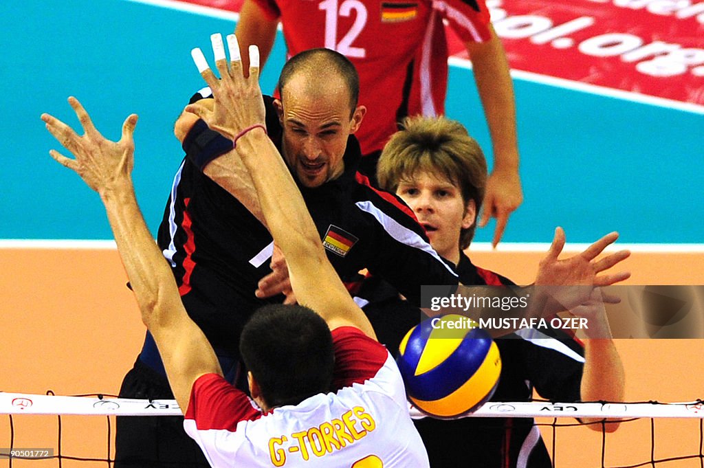Georg Wiebel (back) of Germany spikes th
