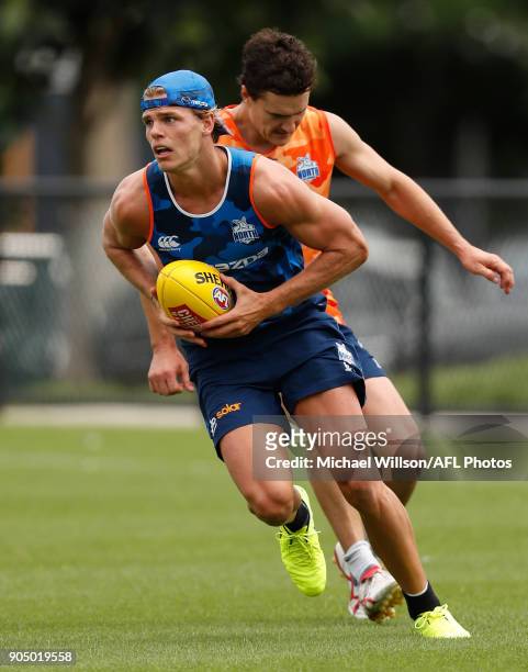 Mason Wood of the Kangaroos in action during a North Melbourne Kangaroos Training Session at Arden Street Ground on January 15, 2018 in Melbourne,...