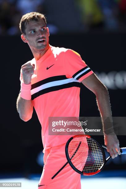 Grigor Dimitrov of Bulgaria celebrates after winning his first round match against Dennis Novak of Austria on day one of the 2018 Australian Open at...