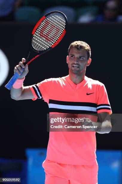 Grigor Dimitrov of Bulgaria celebrates after winning his first round match against Dennis Novak of Austria on day one of the 2018 Australian Open at...