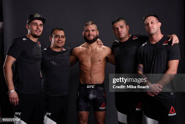 Jeremy Stephens poses for a post fight portrait backstage with his team during the UFC Fight Night event inside the Scottrade Center on January 14,...