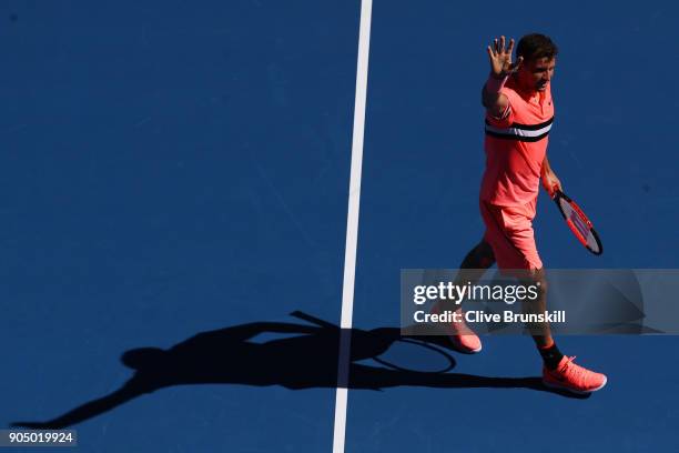 Grigor Dimitrov of Bulgaria celebrates after winning his first round match against Dennis Novak of Austria on day one of the 2018 Australian Open at...