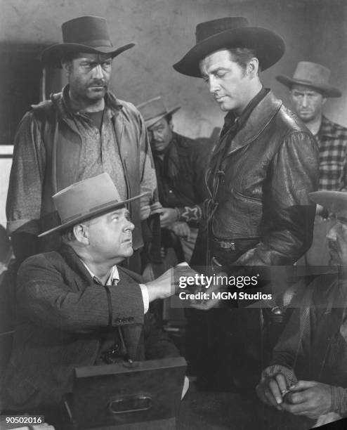 American actor Robert Taylor in a scene from 'Billy the Kid', directed by David Miller, 1941.