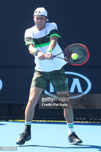 Paolo Lorenzi of Italy plays a backhand in his first round match against Damir Dzhumhur of Bosnia and Herzegovina on day one of the 2018 Australian...