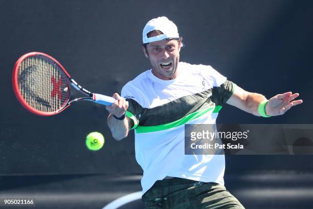 Paolo Lorenzi of Italy plays a forehand in his first round match against Damir Dzhumhur of Bosnia and Herzegovina on day one of the 2018 Australian...
