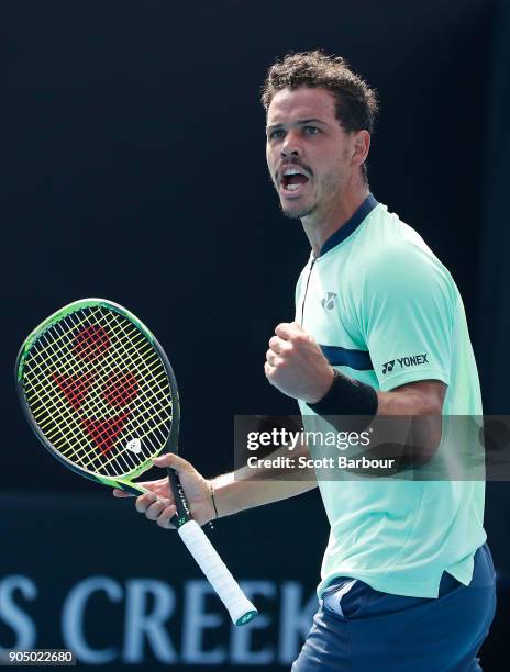 Alex Bolt of Australia celebrates winning a point in his first round match against Viktor Troicki of Serbia on day one of the 2018 Australian Open at...