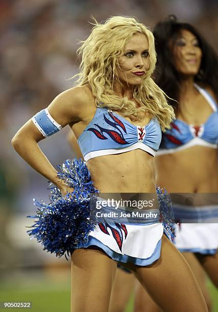 Cheerleader of the Tennessee Titans performs against the Green Bay Packers during a preseason NFL game at LP Field on September 3, 2009 in Nashville,...