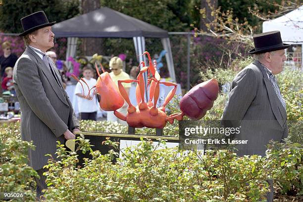 Actors conduct a New Orleans style funeral for a giant fake fire ant at the seventh annual Fire Ant Festival March 23, 2002 in Ashburn, GA. The small...