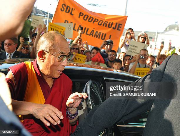 Exiled Tibetan spiritual leader the Dalai Lama is greeted by Slovakian wellwishers upon his arrival at his hotel in Bratislava on September 9,2009...