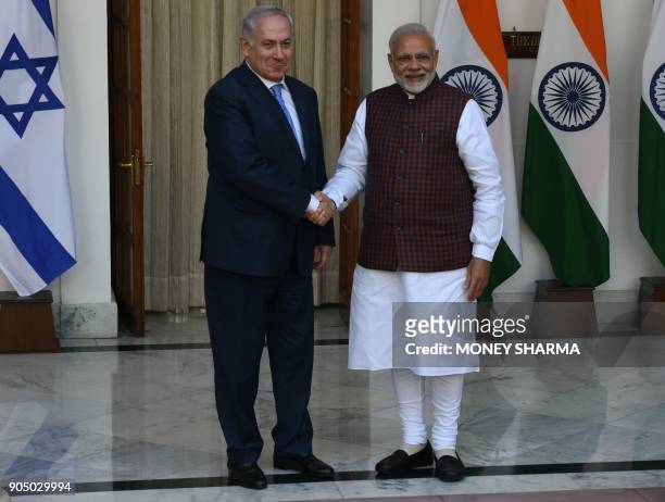 Indian Prime Minister Narendra Modi shakes hand with Israeli Prime Minister Benjamin Netanyahu before a meeting at Hyderabad House in New Delhi on...