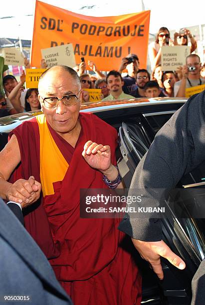 Exiled Tibetan spiritual leader the Dalai Lama is greeted by Slovakian wellwishers upon his arrival at his hotel in Bratislava on September 9, 2009...