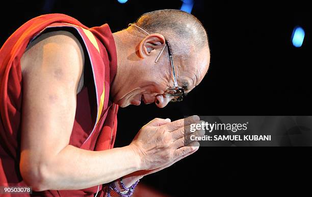 Exiled Tibetan spiritual leader the Dalai Lama gestures as he attends A lecture organised by Jan Langos Foundation in Bratislava on Sptember 9, 2009...