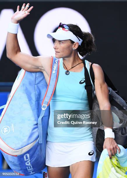 Disappointed Samantha Stosur of Australia waves to the crowd after losing her first round match against Monica Puig of Puerto Rico on day one of the...