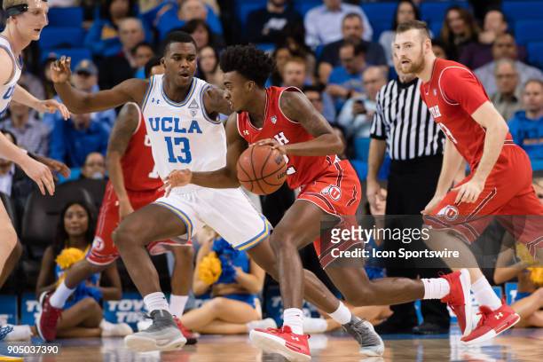 Utah Utes guard Kolbe Caldwell drives the ball inside with UCLA Bruins guard Kris Wilkes defending during the game between the Utah Utes and the UCLA...