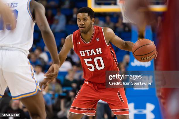 Bruins guard Kris Wilkes defends against Utah Utes guard Christian Popoola during the game between the Utah Utes and the UCLA Bruines on January 11...
