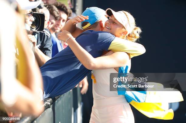 Marta Kostyuk of Ukraine is congratulated by a fan after winning her first round match against Shuai Peng of China on day one of the 2018 Australian...