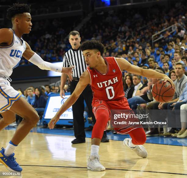 Jaylen Hands of the UCLA Bruins guards Sedrick Barefield of the Utah Utes in the game at Pauley Pavilion on January 11, 2018 in Los Angeles,...