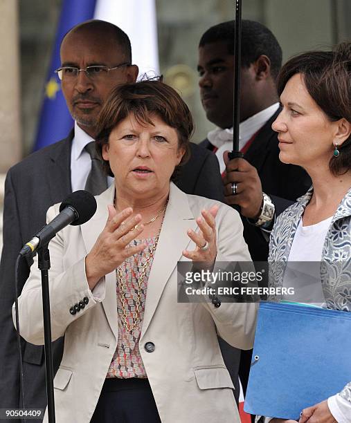 Socialist Party national secretary Martine Aubry flanked by other socialist leaders Laurence Rossignol and Harlem Desir , answers to journalists on...