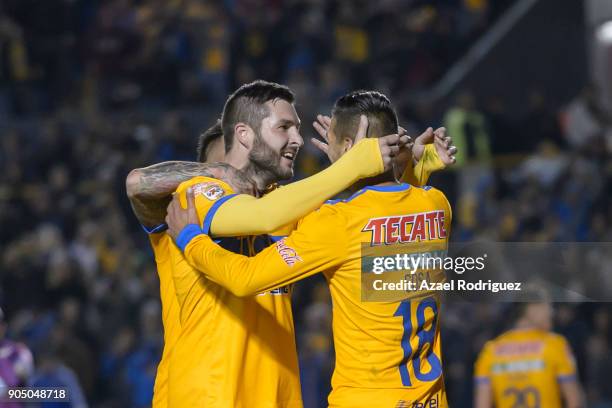 Andre-Pierre Gignac of Tigres celebrates with teammates Eduardo Vargas and Ismael Sosa after scoring his team"u2019s second goal during the 2nd round...