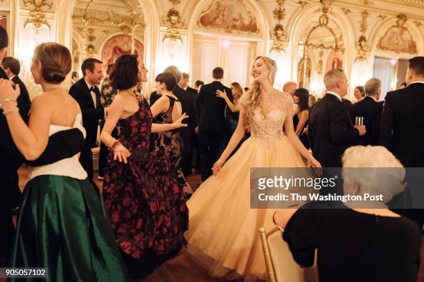 Liz Neblett and Marina Mirabella twirl on the dance floor at the Russian Ball in Washington, DC on January .