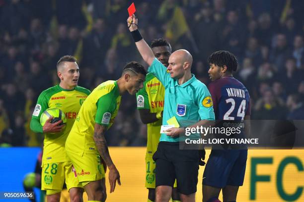 Nantes' Brazilian defender Diego Carlos receives a red card from French referee Tony Chapron during the French L1 football match between Nantes and...