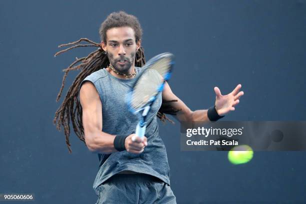 Dustin Brown of Germany plays a forehand in his first round match against Joao Sousa of Portugal on day one of the 2018 Australian Open at Melbourne...