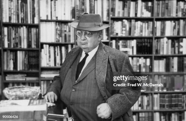 American journalist A.J. Liebling stands at a counter in an unidentified bookstore, New York, New York, October 24, 1961.