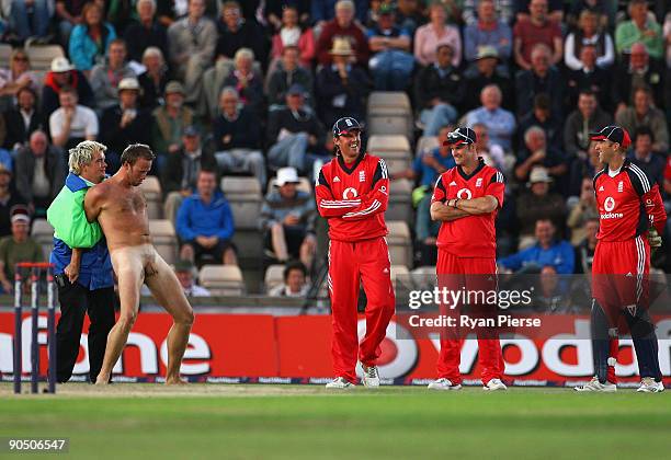 Streaker is tackled by sercurity as England players look on during the 3rd NatWest One Day International between England and Australia at the Rose...