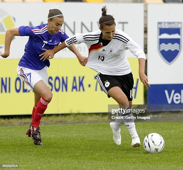 Kyra Malinowski of Germany and Viviane Boudaud of France battle at Women's Euro qualifying match between U17 France and U17 Germany at the Akranes...