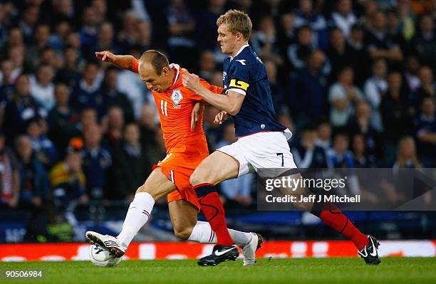 Darren Fletcher of Scotland tackles Arjen Robben of Netherlands during the FIFA 2010 World Cup Group 9 Qualifier match beteween Scotland and...