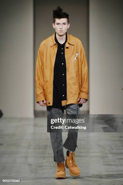 Model walks the runway at the Sulvam Autumn Winter 2018 fashion show during Milan Menswear Fashion Week on January 14, 2018 in Milan, Italy.