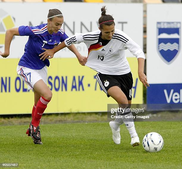 Kyra Malinowski of Germany and Viviane Boudaud of France battle at Women's Euro qualifying match between U17 France and U17 Germany at the Akranes...