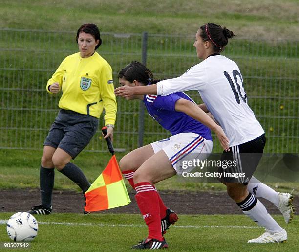 Kyra Malinowski of Germany and Aline Liaigre of France fight for the ball during the Women's Euro qualifying match between U17 Germany and U17 France...