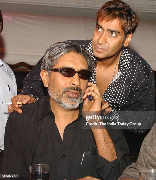 Ajay Devgan, actor of the Movie Apaharan with the director Prakash Jha during the interaction with media in Mumbai, Maharashtra, India