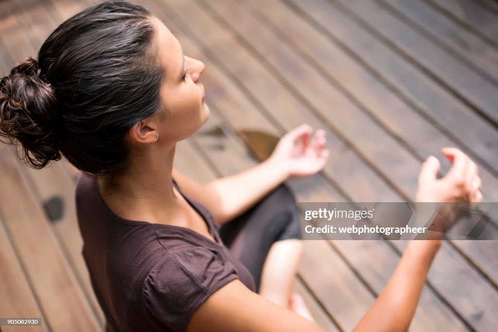 Elevated view of woman meditating