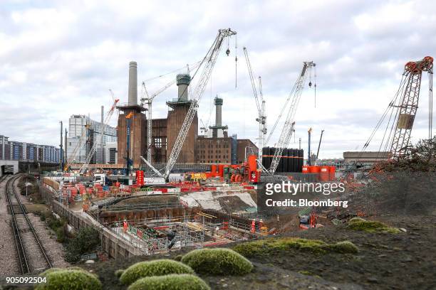 Construction cranes operate at the Battersea Power Station office, retail and residential development in London, U.K., on Wednesday, Jan. 4, 2017....