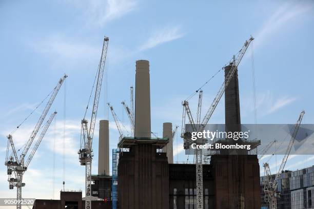 Cranes stand above the Battersea Power Station office, retail and residential development, in London, U.K., on Monday, July 17, 2017. Carillion Plc,...