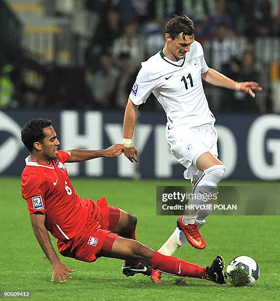 Jacek Krzynowek of Poland (L) vies with, News Photo
