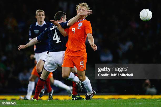 Stephen McManus of Scotland tackles Dirk Kuyt of Netherlands during the FIFA 2010 World Cup Group 9 Qualifier match beteween Scotland and Netherlands...