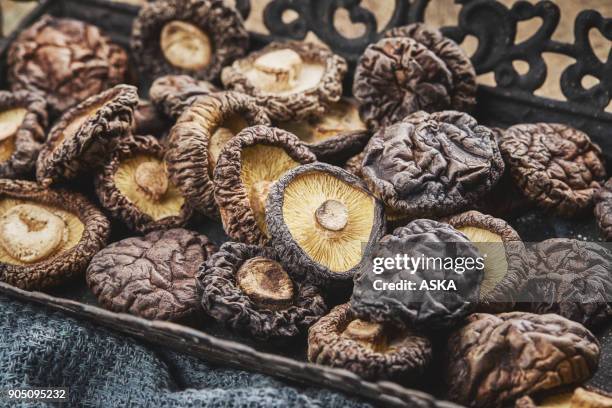 shiitake mushroom on wooden table - dried food stock pictures, royalty-free photos & images