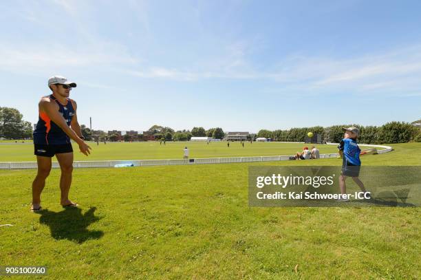 Father and his son play backyard cricket during the ICC U19 Cricket World Cup match between Bangladesh and Canada at Bert Sutcliffe Oval on January...