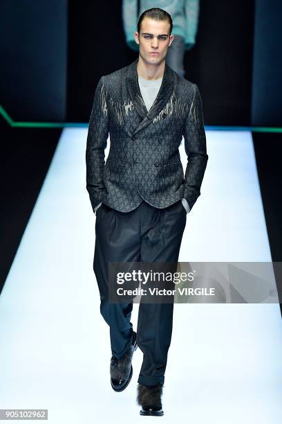 Model walks the runway at the Emporio Armani show during Milan Men's Fashion Week Fall/Winter 2018/19 on January 13, 2018 in Milan, Italy.