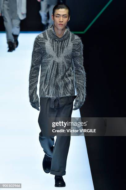 Model walks the runway at the Emporio Armani show during Milan Men's Fashion Week Fall/Winter 2018/19 on January 13, 2018 in Milan, Italy.