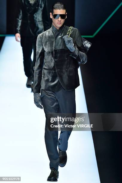 Model walks the runway at the Emporio Armani show during Milan Men's Fashion Week Fall/Winter 2018/19 on January 13, 2018 in Milan, Italy.