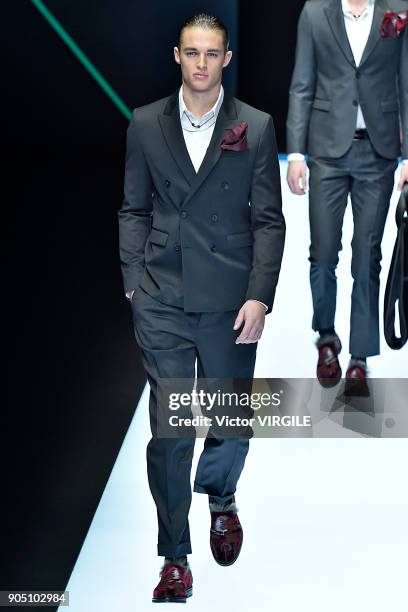 Model walks the runway at the Emporio Armani show during Milan Men's Fashion Week Fall/Winter 2018/19 on January 13, 2018 in Milan, Italy.