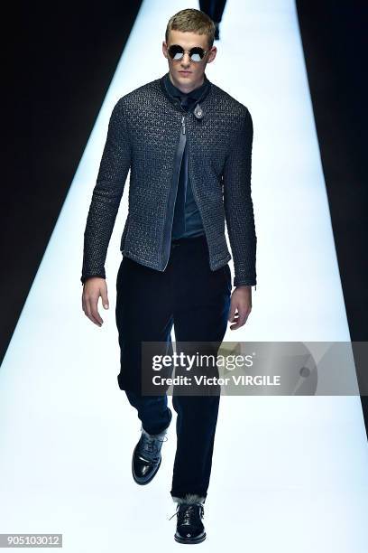 Model walks the runway at the Emporio Armani show during Milan Men's Fashion Week Fall/Winter 2018/19 on January 13, 2018 in Milan, Italy.