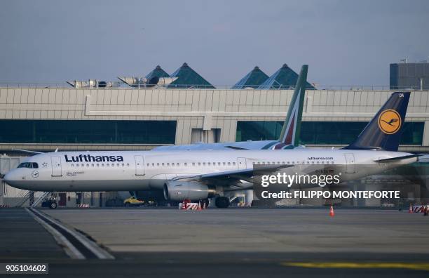 Lufthansa airplane is seen next to an Alitalia aircraft at Rome Fiumicino airport on January 15, 2018. Alitalia, struggling to compete with low-cost...