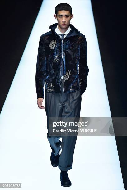 Model walks the runway at the Emporio Armani show during Milan Men's Fashion Week Fall/Winter 2018/19 on January 13, 2018 in Milan, Italy.