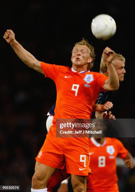 Steven Naismith of Scotland tackles Dirk Kuyt of Netherlands during the FIFA 2010 World Cup Group 9 Qualifier match beteween Scotland and Netherlands...