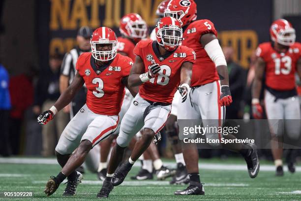 Georgia Bulldogs defensive back Deandre Baker celebrates with Georgia Bulldogs linebacker Roquan Smith and teammates after a play during the College...